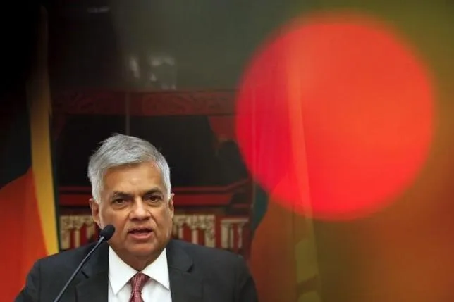 Sri Lankan Prime Minister Ranil Wickremesinghe addresses reporters at a hotel in Beijing