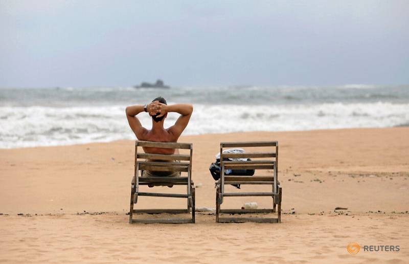 a-tourist-rests-on-a-beach-near-hotels-in-a-tourist-area-in-bentota-1